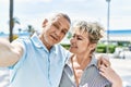 Middle age caucasian couple of husband and wife together on a sunny day outdoors Royalty Free Stock Photo