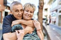 Middle age caucasian couple of husband and wife together on a sunny day outdoors Royalty Free Stock Photo
