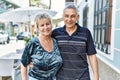 Middle age caucasian couple of husband and wife together on a sunny day outdoors Royalty Free Stock Photo