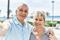 Middle age caucasian couple of husband and wife together on a sunny day outdoors Royalty Free Stock Photo