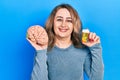 Middle age caucasian woman holding brain and pills as mental health concept smiling with a happy and cool smile on face Royalty Free Stock Photo