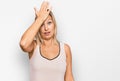Middle age caucasian woman wearing casual clothes surprised with hand on head for mistake, remember error Royalty Free Stock Photo