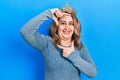 Middle age caucasian woman wearing queen crown smiling making frame with hands and fingers with happy face Royalty Free Stock Photo