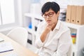Middle age chinese woman business worker suffering for throat pain at office Royalty Free Stock Photo