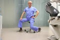 Middle age dentist exercising in his office