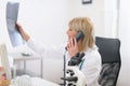 Middle age doctor woman speaking phone Royalty Free Stock Photo