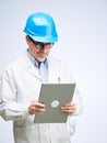 Portrait of happy smiling mid adult engineer on white Royalty Free Stock Photo