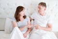 Middle age family couple talking in bed in the morning. Woman and man have dialogue. Healthy relationship. Love and romance Royalty Free Stock Photo