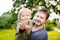 Middle age father with his little son having fun together outdoors Royalty Free Stock Photo