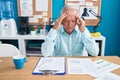 Middle age grey-haired man business worker stressed working at office Royalty Free Stock Photo