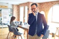 Middle age handsome businessman wearing glasses   standing at the office thinking looking tired and bored with depression problems Royalty Free Stock Photo