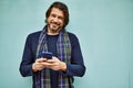 Middle age handsome man using smartphone leaning on the wall Royalty Free Stock Photo