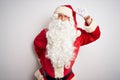 Middle age handsome man wearing Santa costume standing over isolated white background Dancing happy and cheerful, smiling moving Royalty Free Stock Photo