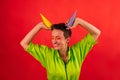 Middle age happy energetic optimistic woman confectioner in colorful uniform with pastry bags