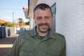 middle age headshot of handsome beard man in green shirt Royalty Free Stock Photo