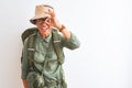 Middle age hiker woman wearing backpack canteen hat glasses over isolated white background doing ok gesture with hand smiling, eye Royalty Free Stock Photo