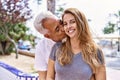 Middle age hispanic couple of husband and wife together on a sunny day outdoors Royalty Free Stock Photo