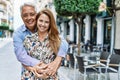 Middle age hispanic couple of husband and wife together on a sunny day outdoors Royalty Free Stock Photo