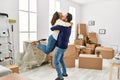 Middle age hispanic couple smiling happy and hugging at new home Royalty Free Stock Photo