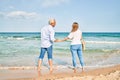 Middle age hispanic couple smiling happy looking at each other face at the beach Royalty Free Stock Photo