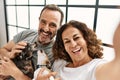 Middle age hispanic couple smiling happy making selfie by the camera Royalty Free Stock Photo