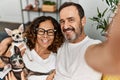 Middle age hispanic couple smiling happy making selfie by the camera Royalty Free Stock Photo