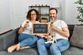 Middle age hispanic couple smiling happy toasting with champagne Royalty Free Stock Photo