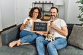 Middle age hispanic couple smiling happy toasting with champagne Royalty Free Stock Photo