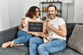 Middle age hispanic couple smiling happy toasting with champagne Royalty Free Stock Photo