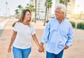 Middle age hispanic couple smiling happy walking at the beach Royalty Free Stock Photo