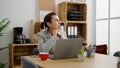 Middle age hispanic woman business worker working at office Royalty Free Stock Photo