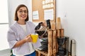 Middle age hispanic woman businesswoman drinking cup of coffee at business office Royalty Free Stock Photo