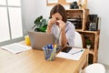 Middle age hispanic woman businesswoman working using laptop resting eyes at business office Royalty Free Stock Photo