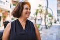 Middle age hispanic woman smiling happy and confident outdoors on a sunny day Royalty Free Stock Photo