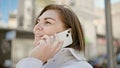 Middle age hispanic woman speaking on the phone at street Royalty Free Stock Photo