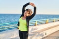 Middle age hispanic woman stretching arms at promenade Royalty Free Stock Photo