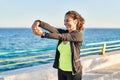 Middle age hispanic woman stretching arms at promenade Royalty Free Stock Photo