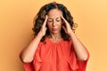 Middle age hispanic woman wearing casual clothes suffering from headache desperate and stressed because pain and migraine Royalty Free Stock Photo