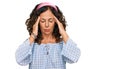 Middle age hispanic woman wearing casual clothes suffering from headache desperate and stressed because pain and migraine Royalty Free Stock Photo