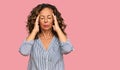 Middle age hispanic woman wearing casual clothes suffering from headache desperate and stressed because pain and migraine Royalty Free Stock Photo