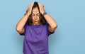 Middle age hispanic woman wearing casual clothes suffering from headache desperate and stressed because pain and migraine Royalty Free Stock Photo