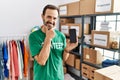 Middle age man with beard wearing volunteer t shirt holding smartphone looking confident at the camera smiling with crossed arms Royalty Free Stock Photo