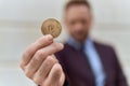 Middle age man business worker holding polkadot crypto currency at street