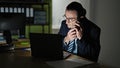 Middle age man business worker using laptop talking on smartphone at the office Royalty Free Stock Photo