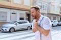 Middle age man coughing at street Royalty Free Stock Photo