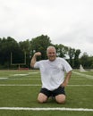 Middle age man exercising sports field Royalty Free Stock Photo