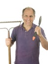 Middle age man gardener spade and bow rake tools