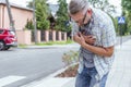 Man having a heart attack on the street Royalty Free Stock Photo
