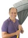 Middle age man holding garden leaf rake tool Royalty Free Stock Photo