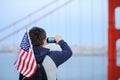 Middle age man making mobile photo on Golden Gate bridge Royalty Free Stock Photo